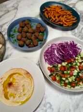 Crispy Green Falafels with Hummus, Herby Salad & Baked Chips